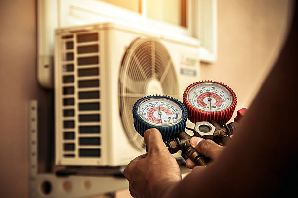 Professional Heat Pump Repair technician working in Charlestown, IN